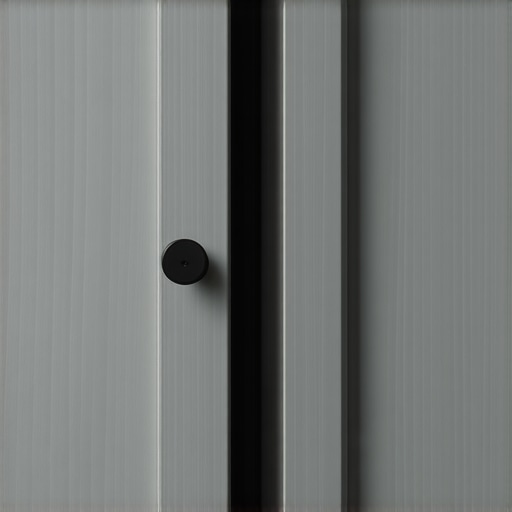 A close-up of a custom-built recessed cabinet panel with a concealed finger pull, integrated into modern kitchen cabinetry